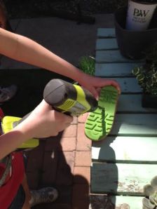 Drill a hole in the ribber rain boot sole